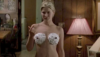 Close up of Ali Larter nude with whipped cream on her breasts
