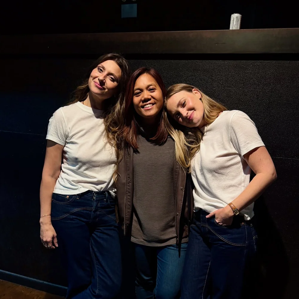 Three women posing close to each other