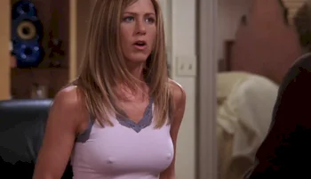 Close up of a braless Jennifer Aniston with her mouth open