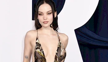 Close up of a woman wearing a revealing dress on the red carpet