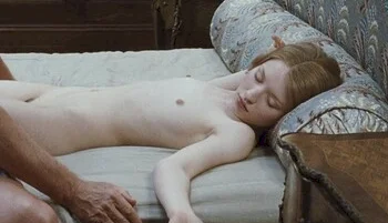Side view of Emily Browning nude on her back