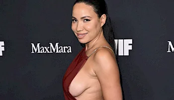 Side view of woman showing side breast in a sexy dress