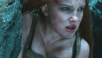 Close up of girl looking to off to the side with dirt on her face