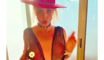 Close up screen cap of Britney Spears dancing