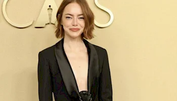 Close up of Emma Stone smiling on a red carpet