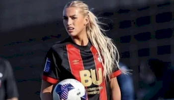 Close up of a female Soccer Player holding a ball in her hand