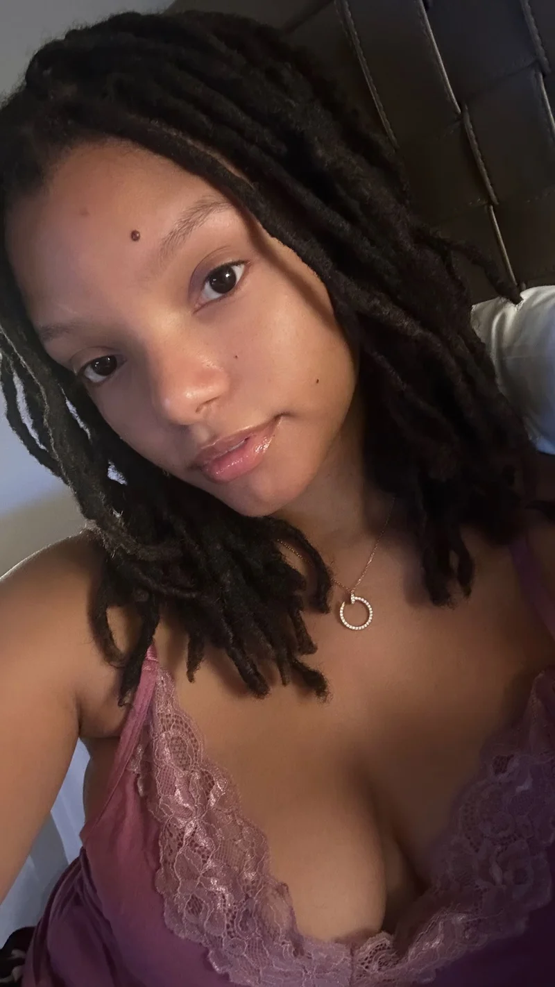 Halle Bailey takes a selfie of her face and chest wearing a nightie