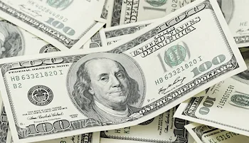 Scattered hundred dollar bills