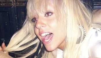 Lady Gaga with long blonde hair smiling