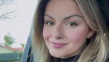 Close up of smiling woman in a car