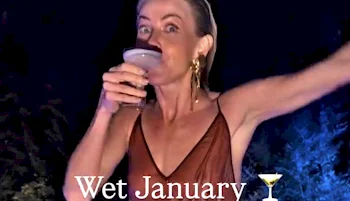A woman in a brown dress raises one arm and drinks from a cocktail glass at night. The words Wet January with a martini emoji are displayed at the bottom of the image.