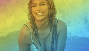 A woman with wet hair smiles brightly while sitting at the beach, wearing a light-colored swimsuit. The image has a rainbow gradient overlay.