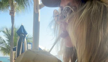 Heidi Klum Enjoys A Coconut In A Sheer Top!