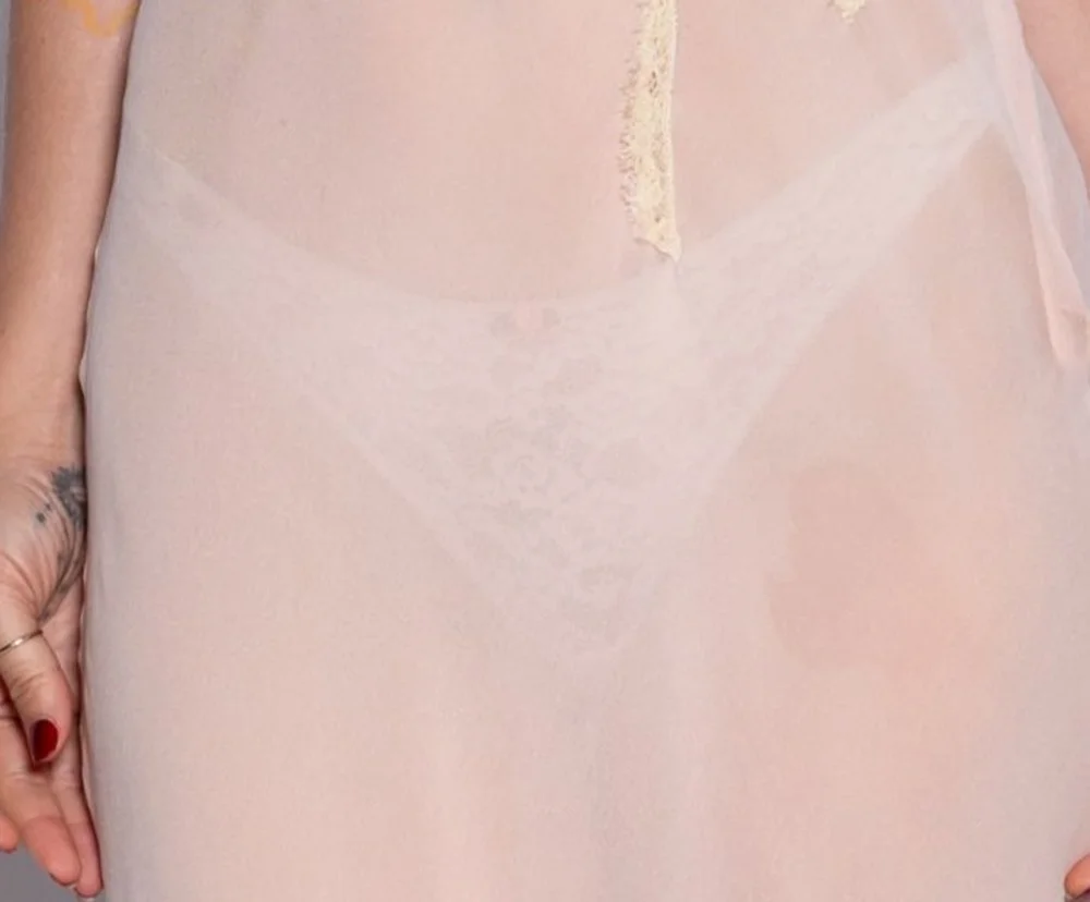 ScoutWillisSeeThrough26ErmannoScervinoMilanPic3 A sheer, pale pink garment worn over a matching lace thong.